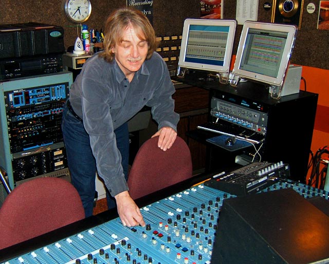 bob both, record producer at the mixing console in the recording studio