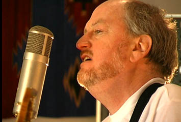 Graham Lyle records vocals at his studio