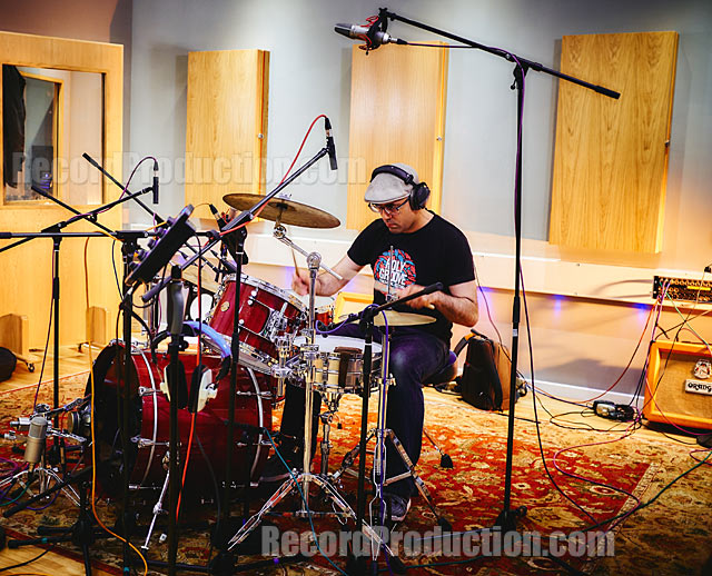 Emre Ramazanoglu playing drums in the studio