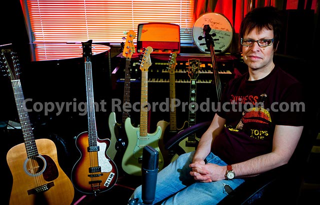 musician and record producer george shilling at his studio with guitar collection